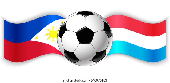 Filipino and Luxembourgish wavy flags with football ball. Philippines combined with Luxembourg isolated on white. Football match or international sport competition concept.
