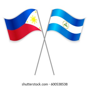 Filipino and Nicaraguan crossed flags. Philippines combined with Nicaragua isolated on white. Language learning, international business or travel concept.