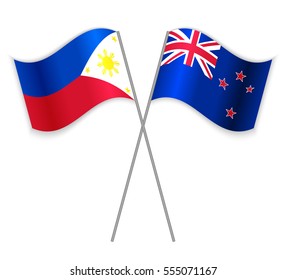 Filipino and NZ crossed flags. Philippines combined with New Zealand isolated on white. Language learning, international business or travel concept.