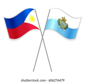 Filipino and Sammarinese crossed flags. Philippines combined with San Marino isolated on white. Language learning, international business or travel concept.