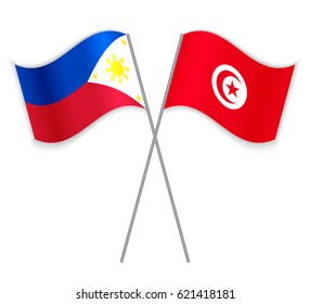 Filipino and Tunisian crossed flags. Philippines combined with Tunisia isolated on white. Language learning, international business or travel concept.