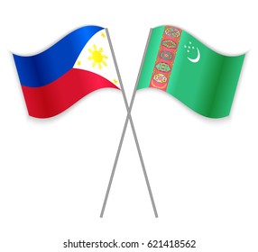 Filipino and Turkmen crossed flags. Philippines combined with Turkmenistan isolated on white. Language learning, international business or travel concept.