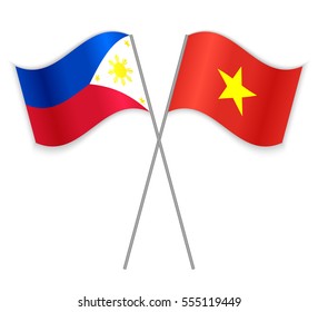 Filipino and Vietnamese crossed flags. Philippines combined with Vietnam isolated on white. Language learning, international business or travel concept.