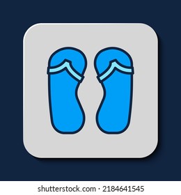 Filled outline Flip flops icon isolated on blue background. Beach slippers sign.  Vector