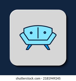 Filled outline Sofa icon isolated on blue background.  Vector