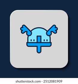 Filled outline Viking in horned helmet icon isolated on blue background.  Vector