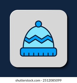 Filled outline Winter hat icon isolated on blue background.  Vector