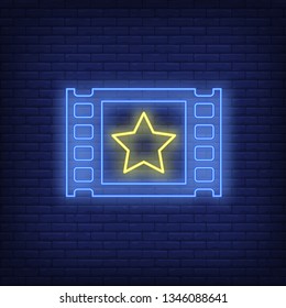 Film cadre neon sign. Glowing film frame with yellow star on brick wall background.Vector illustration can be used for cinema, entertainment, filming