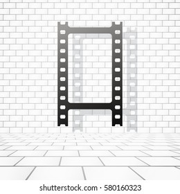 Film or camera strip with shadow near white brick wall
