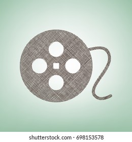 Film circular sign. Vector. Brown flax icon on green background with light spot at the center.