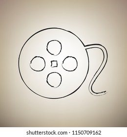 Film circular sign. Vector. Brush drawed black icon at light brown background.