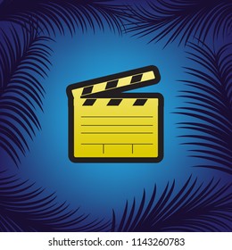 Film clap board cinema sign. Vector. Golden icon with black contour at blue background with branches of palm trees.