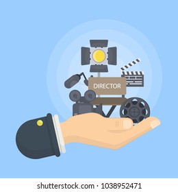 Film director illustration. Hand holding camera, chair and light.