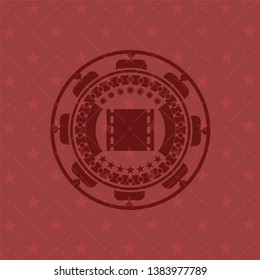 film icon inside badge with red background