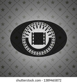 film icon inside black badge