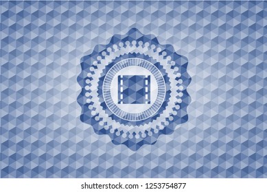 film icon inside blue emblem or badge with geometric pattern background.