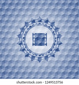 film icon inside blue hexagon badge.