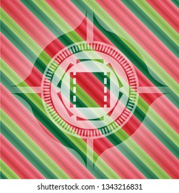 film icon inside christmas emblem background.