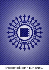film icon inside denim background