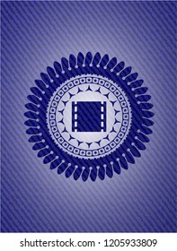 film icon inside emblem with denim high quality background