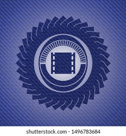 film icon inside emblem with denim texture