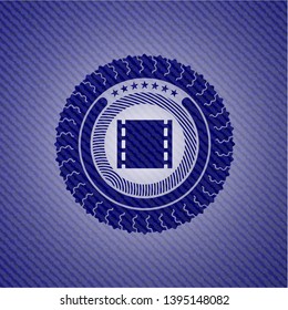 film icon inside emblem with jean texture