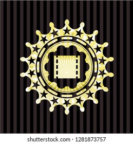 film icon inside gold emblem