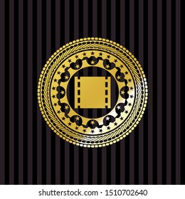 film icon inside gold shiny badge