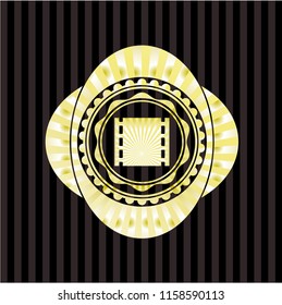 film icon inside golden badge