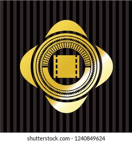 film icon inside golden badge or emblem
