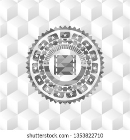 film icon inside grey badge with geometric cube white background