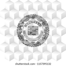 film icon inside grey icon or emblem with geometric cube white background