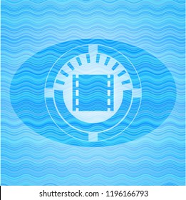 film icon inside light blue water wave badge.