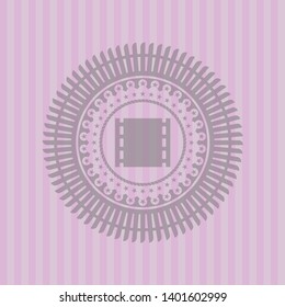 film icon inside pink emblem