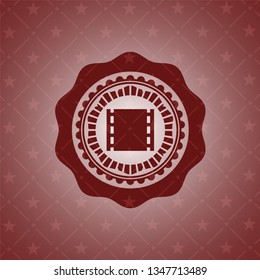film icon inside realistic red emblem