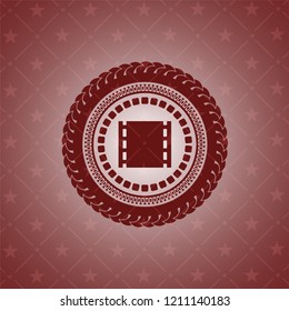 film icon inside red icon or emblem