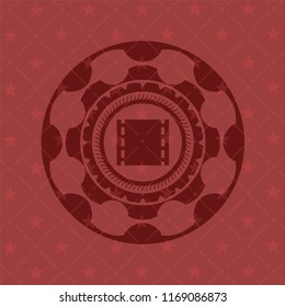 film icon inside retro red emblem