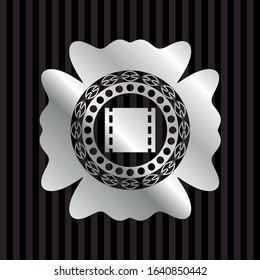 film icon inside silver shiny emblem