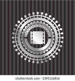 film icon inside silvery badge