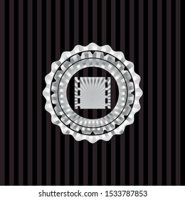 film icon inside silvery emblem or badge