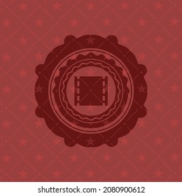 film icon inside vintage red emblem. 