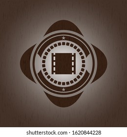 film icon inside wood emblem. Vintage.