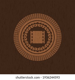 film icon inside wooden emblem. Retro. 