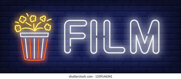 Film neon text with popcorn bucket. Cinema and entertainment concept, advertisement design. Night bright neon sign, colorful billboard, light banner. Vector illustration in neon style.