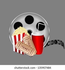 film with popcorn and a drink on a gray background