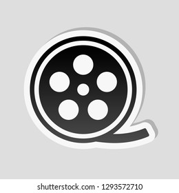 Film roll, old movie strip icon, cinema logo. Sticker style with white border and simple shadow on gray background
