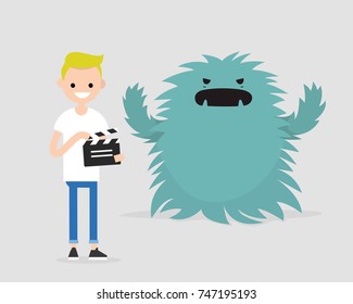 Film set. Horror movie. Big scary monster. Young character holding a retro clapper board. Entertainment industry / flat editable vector illustration, clip art