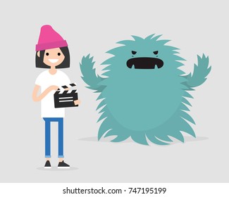 Film set. Horror movie. Big scary monster. Young girl holding a retro clapper board. Entertainment industry / flat editable vector illustration, clip art