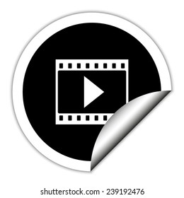 film strip with play - black vector icon. Round sticker.