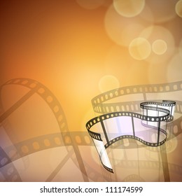 Film stripe or film reel on shiny movie background. EPS 10